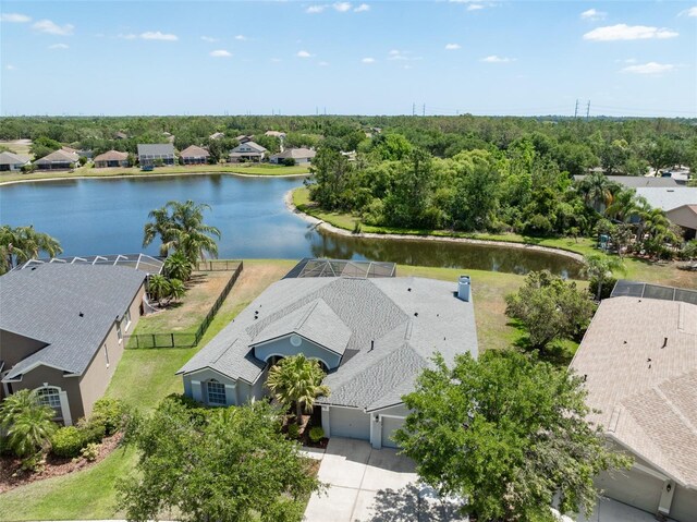 drone / aerial view with a water view and a residential view