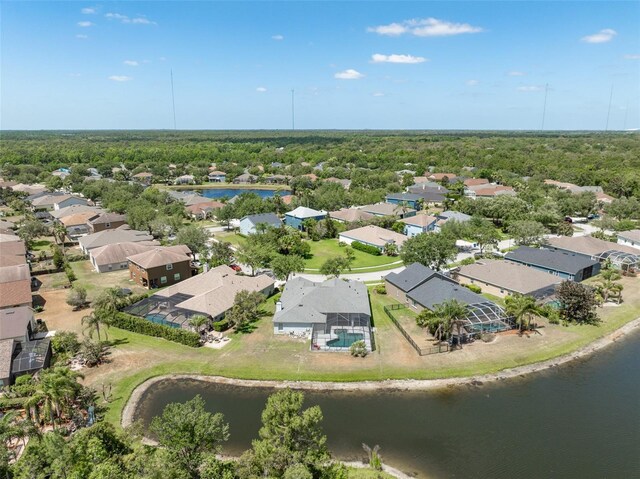 drone / aerial view with a water view and a residential view