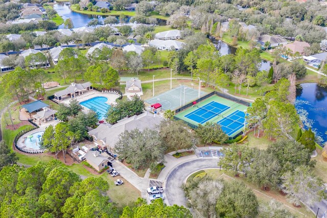birds eye view of property featuring a water view and a residential view