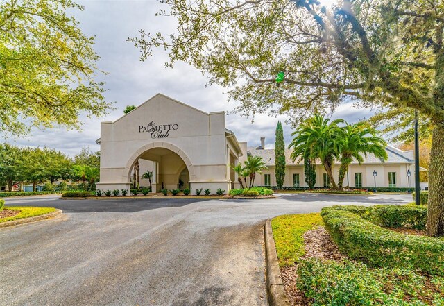view of property with curved driveway