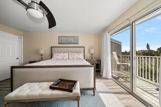 bedroom featuring access to outside, ceiling fan, and light wood-style floors