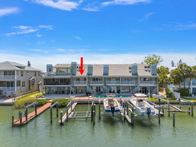 view of dock with a residential view, boat lift, a water view, and stairs