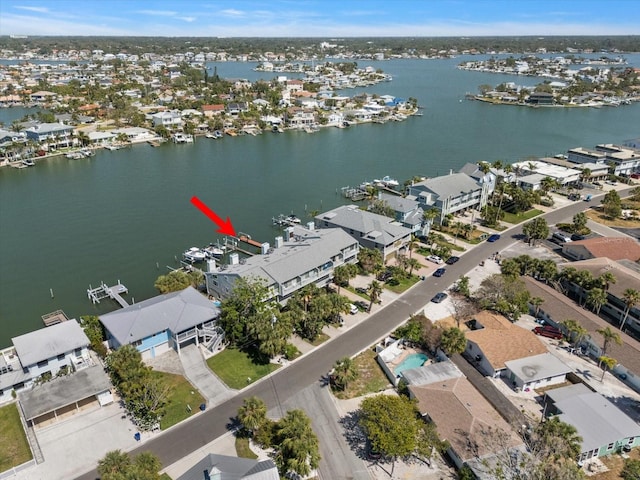 bird's eye view featuring a water view and a residential view