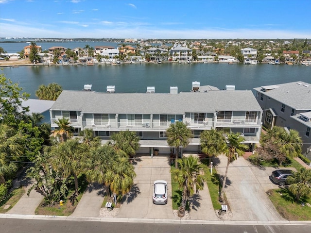 bird's eye view with a water view and a residential view