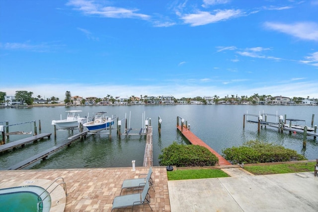 view of dock with boat lift and a water view