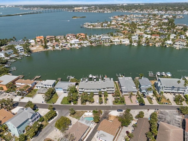 bird's eye view featuring a water view and a residential view