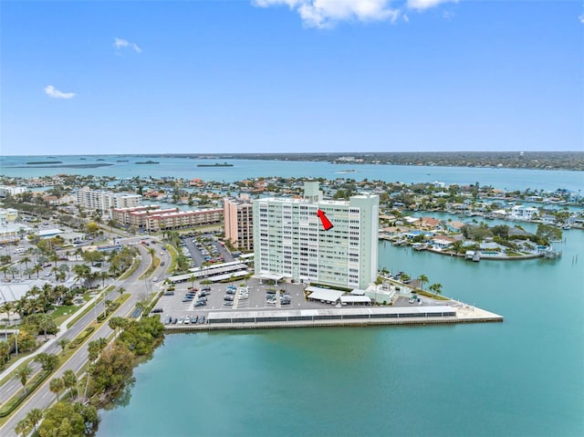 birds eye view of property featuring a water view and a view of city