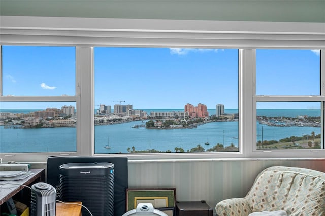 interior space featuring a view of city and a water view
