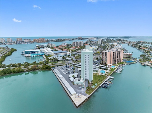 drone / aerial view featuring a view of city and a water view