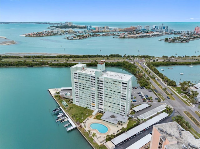 drone / aerial view with a city view and a water view