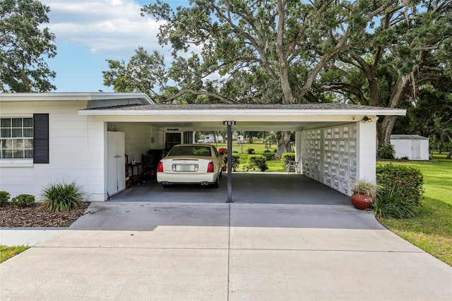 view of parking / parking lot with concrete driveway and a carport