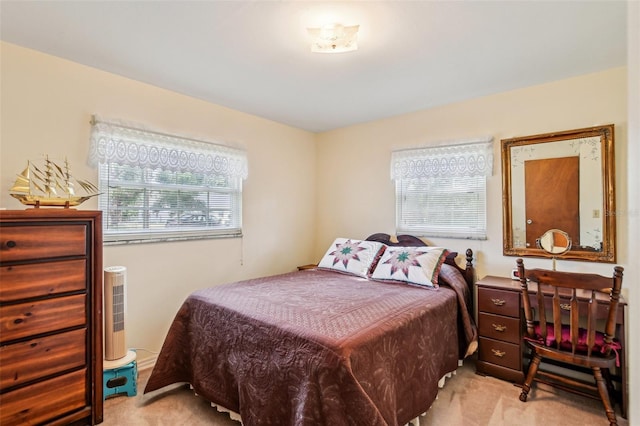 bedroom with light colored carpet