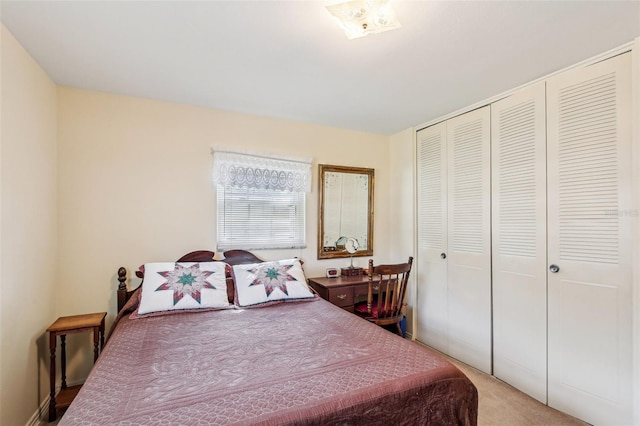 carpeted bedroom featuring a closet