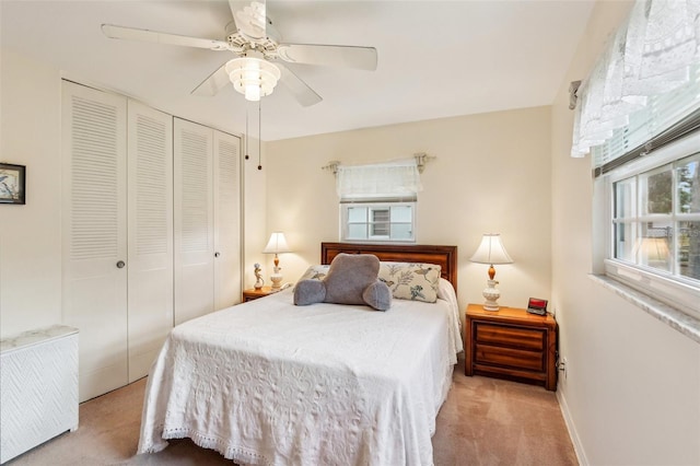 bedroom with a closet, baseboards, ceiling fan, and carpet floors