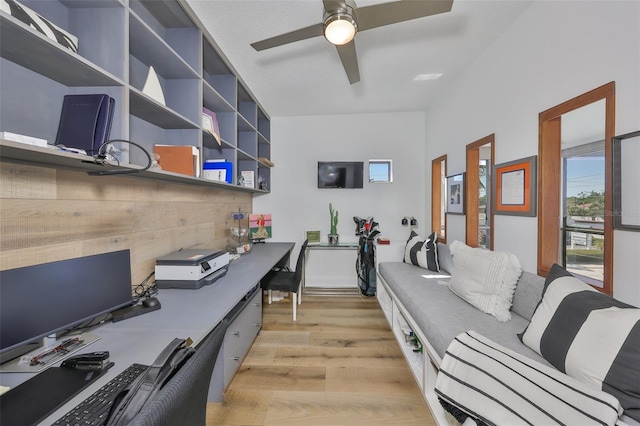 home office featuring a ceiling fan and light wood finished floors