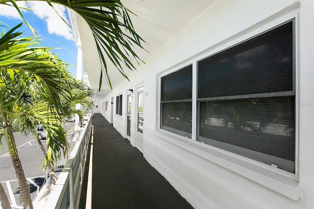 3128 59th St S Unit 206, Gulfport, FL 33707 - view of home's exterior with stucco siding and a balcony