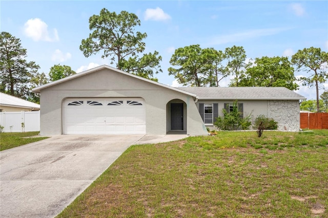 3353 Montano Ave, Spring Hill, FL 34609 - ranch-style home featuring a front lawn, driveway, fence, and a garage