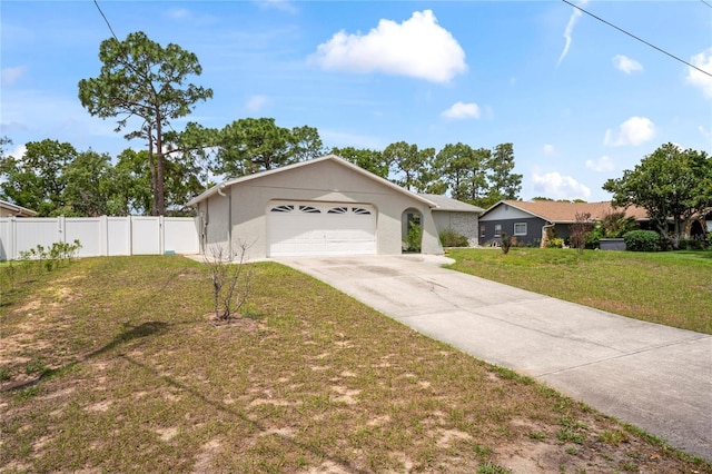 3353 Montano Ave, Spring Hill, FL 34609 - ranch-style house featuring driveway, a front lawn, fence, and a garage