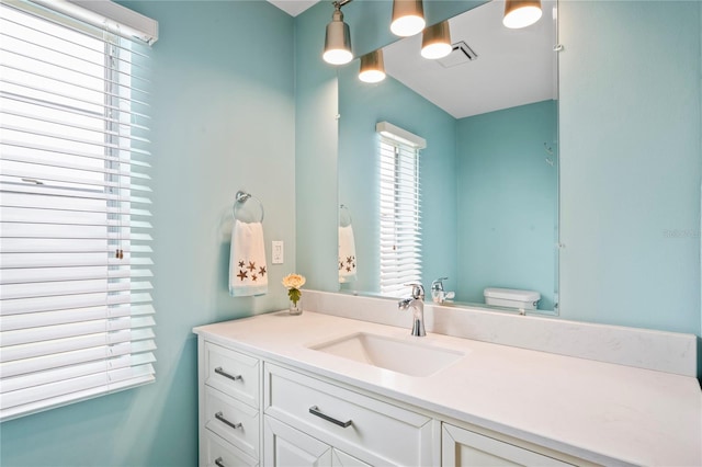 3353 Montano Ave, Spring Hill, FL 34609 - bathroom featuring vanity, toilet, and visible vents