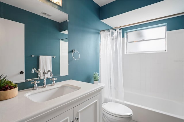 3353 Montano Ave, Spring Hill, FL 34609 - bathroom featuring toilet, shower / bath combo with shower curtain, vanity, and visible vents