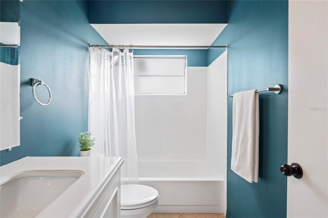 3353 Montano Ave, Spring Hill, FL 34609 - full bath featuring shower / bath combo with shower curtain, toilet, tile patterned flooring, and a sink