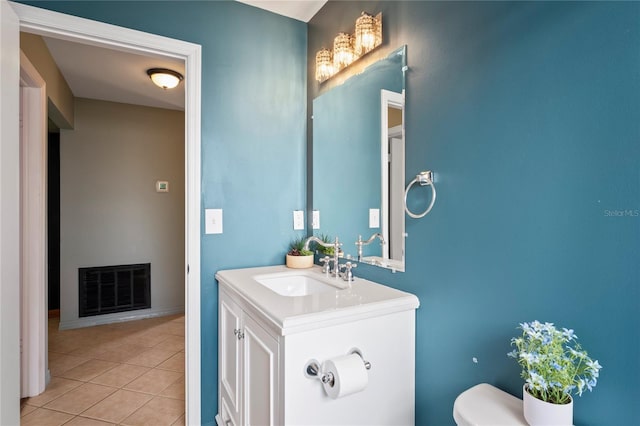 3353 Montano Ave, Spring Hill, FL 34609 - half bath featuring tile patterned floors, toilet, visible vents, and vanity