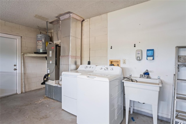3353 Montano Ave, Spring Hill, FL 34609 - washroom featuring independent washer and dryer, water heater, laundry area, heating unit, and concrete block wall