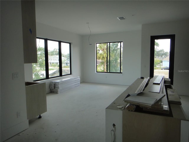 office area featuring carpet flooring and visible vents