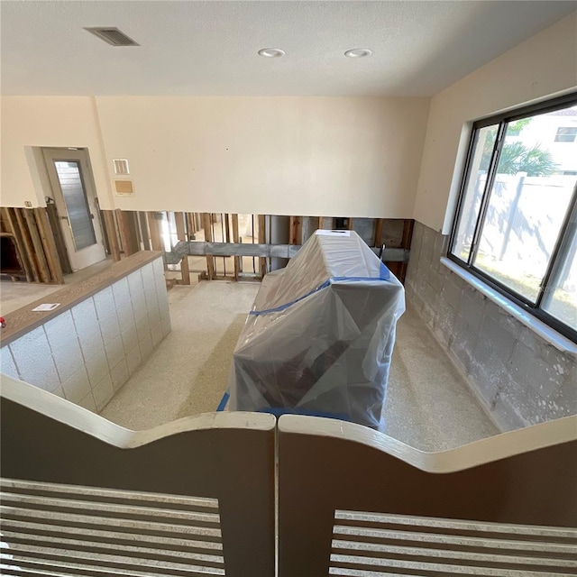 2015 Dolphin Blvd S, Saint Petersburg, FL 33707 - miscellaneous room featuring carpet floors, recessed lighting, visible vents, and a wainscoted wall