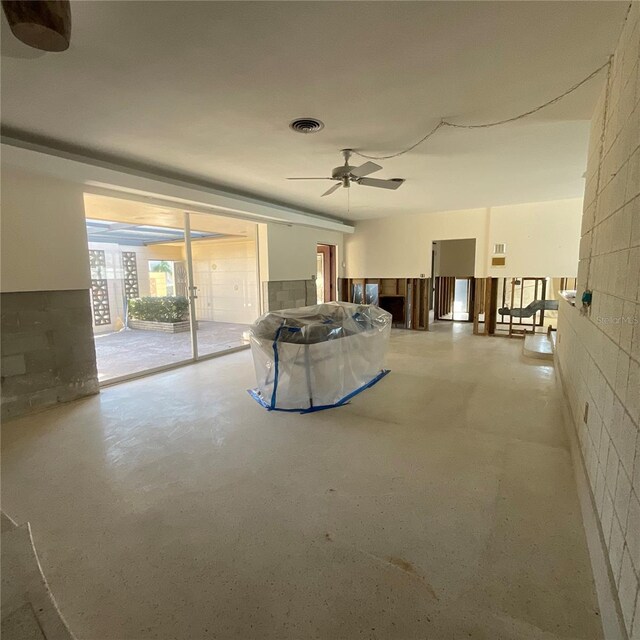 2015 Dolphin Blvd S, Saint Petersburg, FL 33707 - living room with ceiling fan, concrete flooring, and visible vents