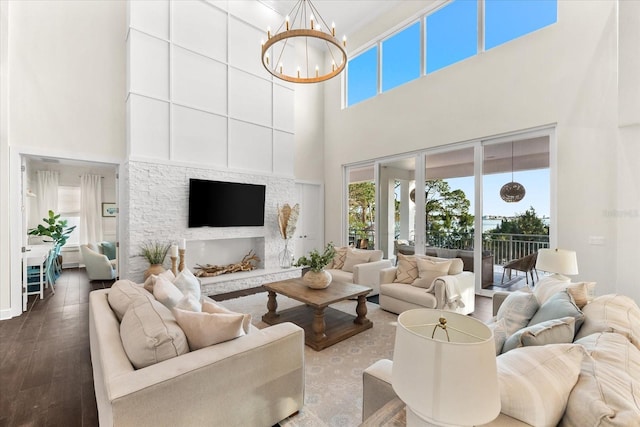 885 Seaview Cir Unit 20, Crystal Beach, FL 34681 - living room with a towering ceiling, healthy amount of natural light, wood finished floors, and a chandelier