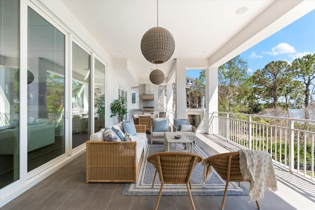 885 Seaview Cir Unit 20, Crystal Beach, FL 34681 - view of patio with an outdoor hangout area and a balcony