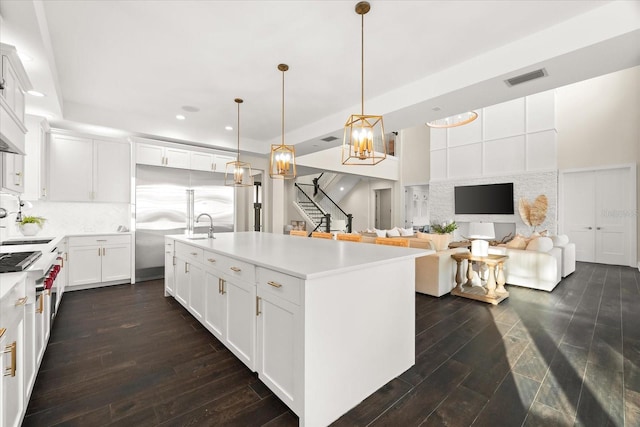 885 Seaview Cir Unit 20, Crystal Beach, FL 34681 - kitchen featuring recessed lighting, dark wood-style flooring, light countertops, white cabinets, and decorative light fixtures