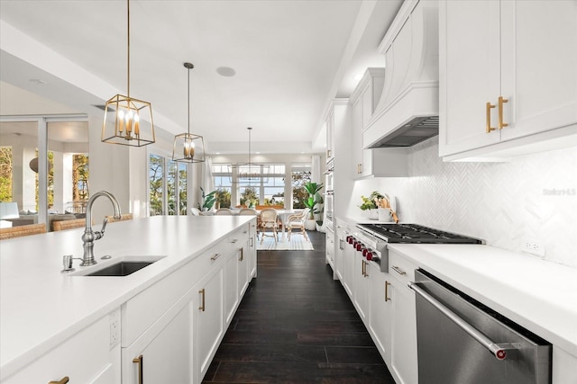 885 Seaview Cir Unit 20, Crystal Beach, FL 34681 - kitchen featuring a sink, appliances with stainless steel finishes, premium range hood, light countertops, and recessed lighting