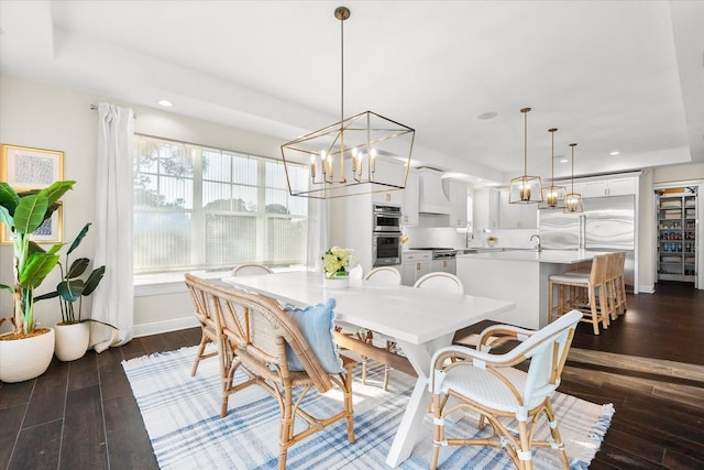 885 Seaview Cir Unit 20, Crystal Beach, FL 34681 - dining room featuring dark wood-style flooring, recessed lighting, a chandelier, and baseboards