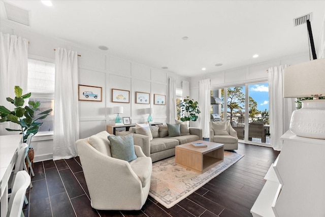 885 Seaview Cir Unit 20, Crystal Beach, FL 34681 - living area with dark wood finished floors, recessed lighting, and a decorative wall