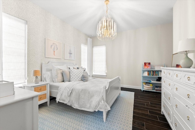 885 Seaview Cir Unit 20, Crystal Beach, FL 34681 - bedroom featuring a chandelier, baseboards, dark wood-style flooring, and wallpapered walls