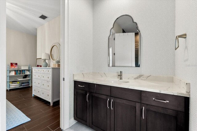 885 Seaview Cir Unit 20, Crystal Beach, FL 34681 - bathroom with wood finished floors, vanity, and baseboards