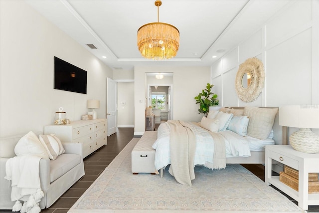 885 Seaview Cir Unit 20, Crystal Beach, FL 34681 - bedroom featuring dark wood-type flooring, a chandelier, a raised ceiling, and recessed lighting