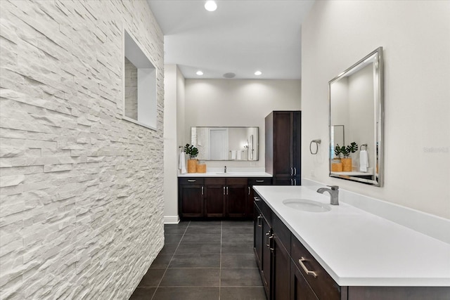885 Seaview Cir Unit 20, Crystal Beach, FL 34681 - bathroom with tile patterned floors, two vanities, and recessed lighting