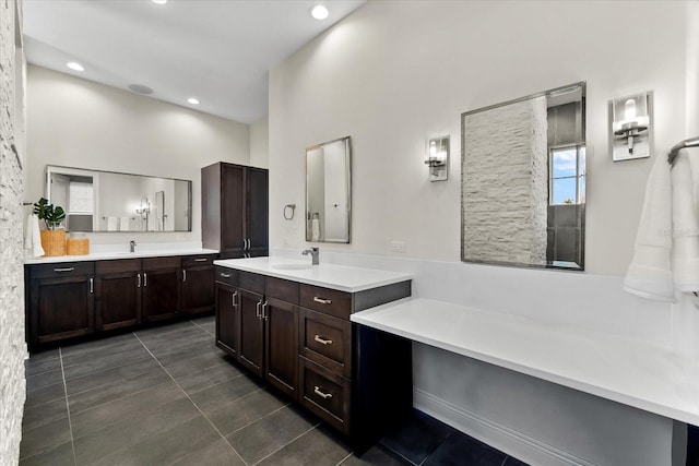 885 Seaview Cir Unit 20, Crystal Beach, FL 34681 - full bathroom with tile patterned floors, two vanities, recessed lighting, and a high ceiling