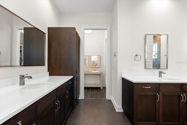 885 Seaview Cir Unit 20, Crystal Beach, FL 34681 - full bathroom with tile patterned floors, two vanities, and baseboards