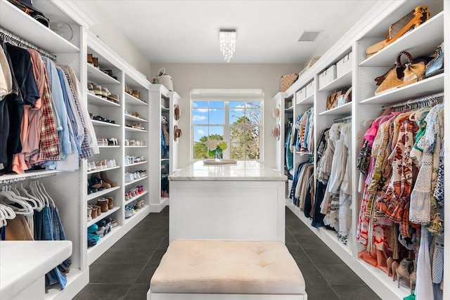 885 Seaview Cir Unit 20, Crystal Beach, FL 34681 - walk in closet featuring dark tile patterned flooring