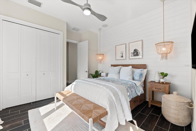 885 Seaview Cir Unit 20, Crystal Beach, FL 34681 - bedroom with a closet, wood finish floors, and ceiling fan