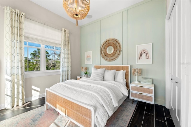 885 Seaview Cir Unit 20, Crystal Beach, FL 34681 - bedroom with baseboards and a chandelier