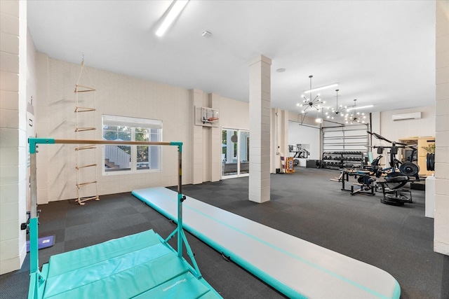885 Seaview Cir Unit 20, Crystal Beach, FL 34681 - exercise room with a wall mounted AC, ornate columns, and a chandelier