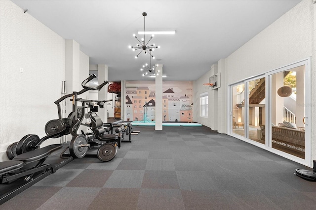 885 Seaview Cir Unit 20, Crystal Beach, FL 34681 - workout area featuring carpet flooring and a chandelier