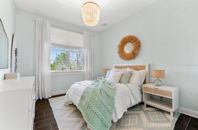 885 Seaview Cir Unit 20, Crystal Beach, FL 34681 - bedroom with baseboards, wood tiled floors, and a chandelier