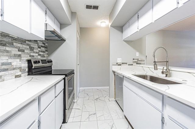 kitchen featuring a textured ceiling, a sink, marble finish floor, stainless steel appliances, and extractor fan