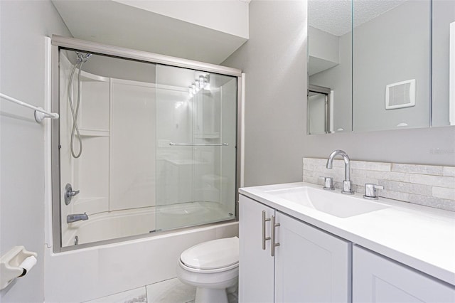 bathroom with visible vents, shower / bath combination with glass door, toilet, and vanity
